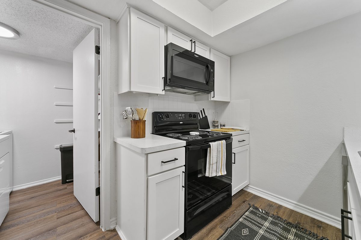 Renovated Kitchen with White Cabinets at Lakeside Apartments
