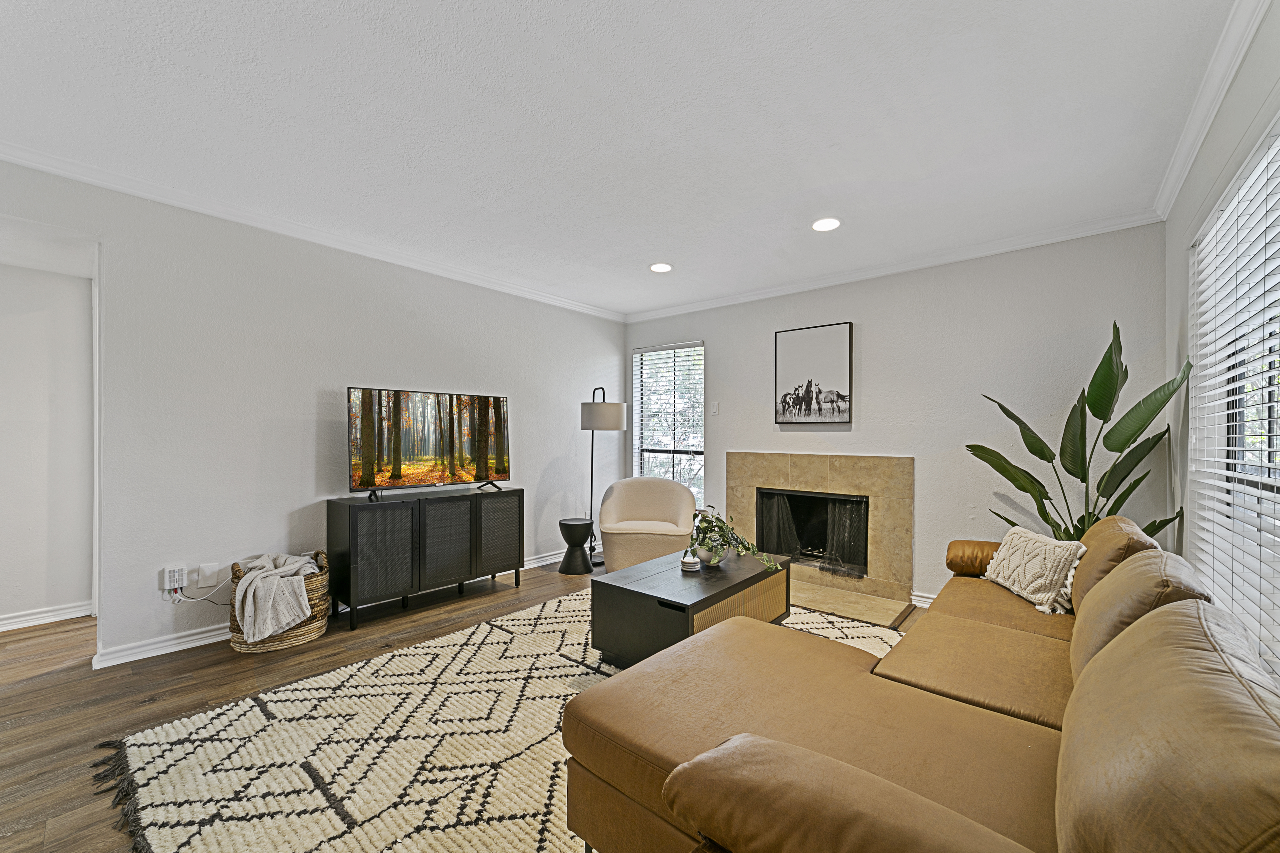 One bedroom apartment living room with fireplace at Lakeside